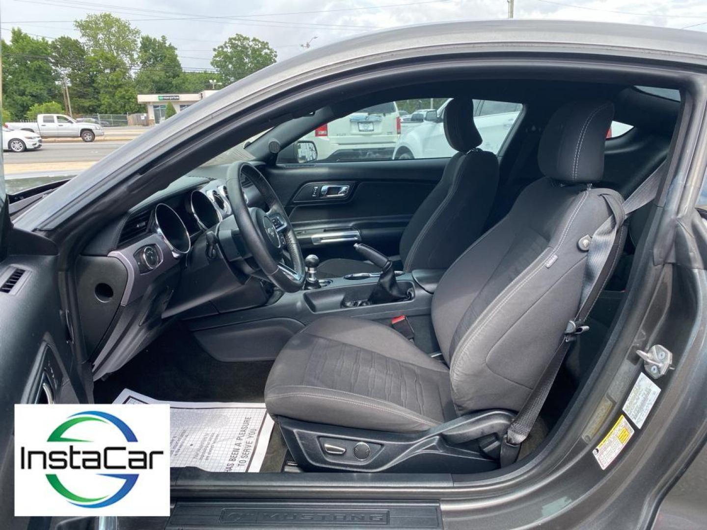 2017 Magnetic Metallic /Ebony Ford Mustang EcoBoost (1FA6P8TH6H5) with an L4, 2.3L engine, Manual 6-Speed transmission, located at 3147 E Independence Blvd, Charlotte, NC, 28205, 35.200268, -80.773651 - <b>Equipment</b><br>The HID headlamps on the Ford Mustang light your way like never before. Bluetooth technology is built into this vehicle, keeping your hands on the steering wheel and your focus on the road. Protect this small car from unwanted accidents with a cutting edge backup camera system. I - Photo#19