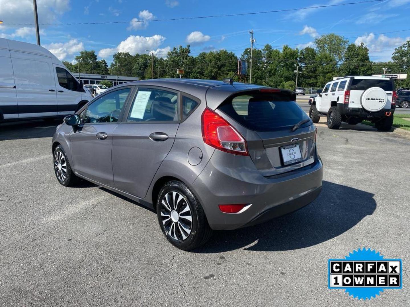 2014 Storm Gray Metallic /Charcoal Black w/Red Stitching Ford Fiesta SE (3FADP4EJ9EM) with an L4, 1.6L engine, 5-speed manual transmission, located at 3147 E Independence Blvd, Charlotte, NC, 28205, 35.200268, -80.773651 - <b>Equipment</b><br>This 2014 Ford Fiesta features a hands-free Bluetooth phone system. This vehicle is a certified CARFAX 1-owner. This vehicle has a L4, 1.6L high output engine. Front wheel drive on this 2014 Ford Fiesta gives you better traction and better fuel economy. Set the temperature exac - Photo#10