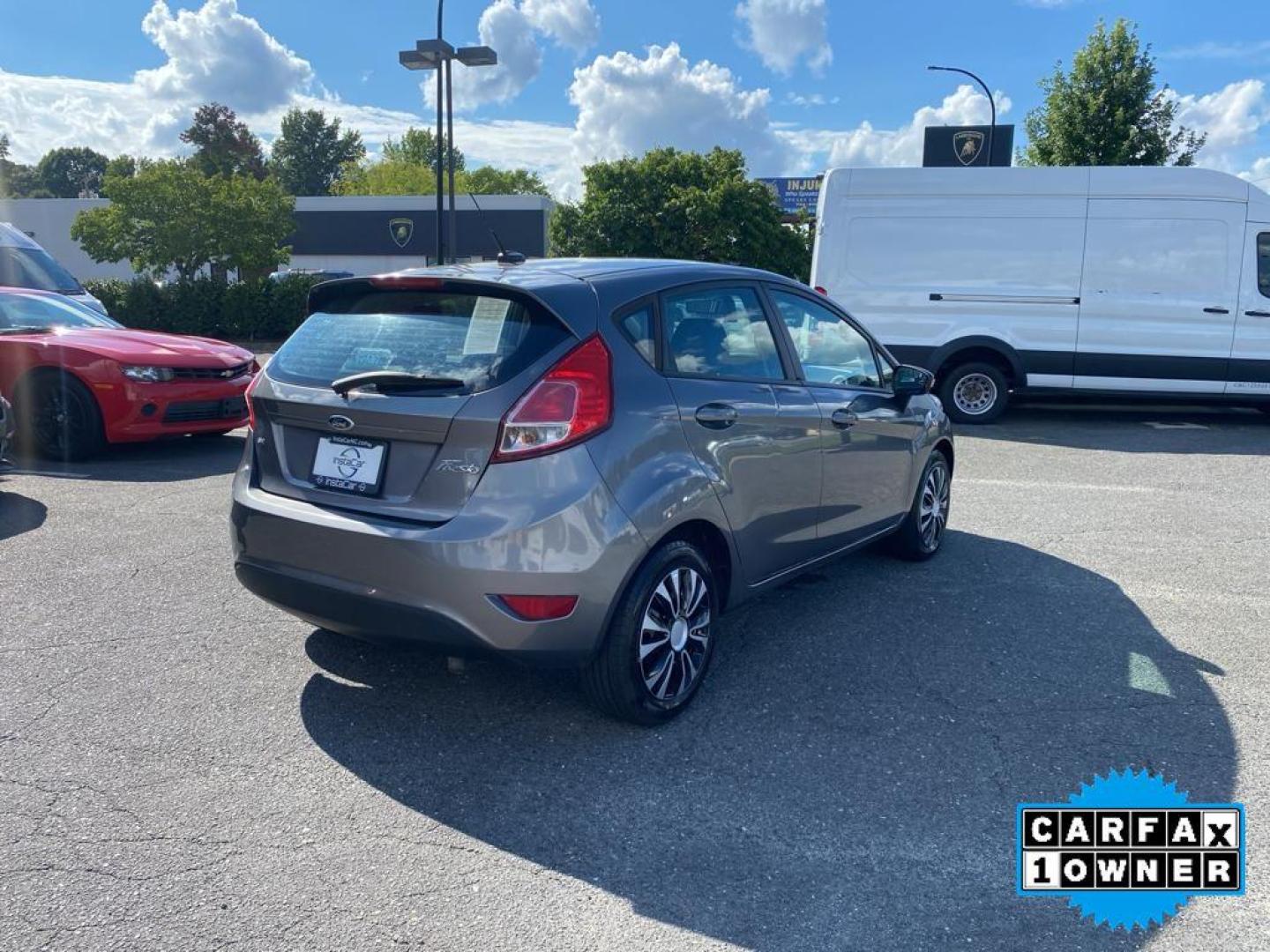 2014 Storm Gray Metallic /Charcoal Black w/Red Stitching Ford Fiesta SE (3FADP4EJ9EM) with an L4, 1.6L engine, 5-speed manual transmission, located at 3147 E Independence Blvd, Charlotte, NC, 28205, 35.200268, -80.773651 - <b>Equipment</b><br>This 2014 Ford Fiesta features a hands-free Bluetooth phone system. This vehicle is a certified CARFAX 1-owner. This vehicle has a L4, 1.6L high output engine. Front wheel drive on this 2014 Ford Fiesta gives you better traction and better fuel economy. Set the temperature exac - Photo#12