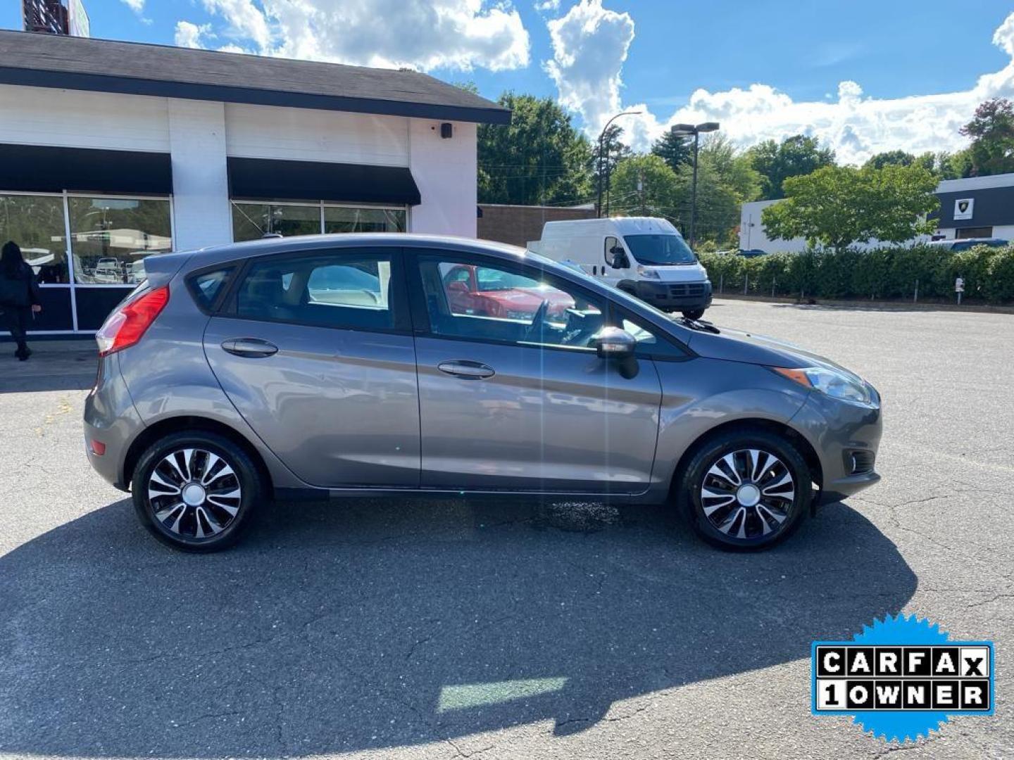 2014 Storm Gray Metallic /Charcoal Black w/Red Stitching Ford Fiesta SE (3FADP4EJ9EM) with an L4, 1.6L engine, 5-speed manual transmission, located at 3147 E Independence Blvd, Charlotte, NC, 28205, 35.200268, -80.773651 - <b>Equipment</b><br>This 2014 Ford Fiesta features a hands-free Bluetooth phone system. This vehicle is a certified CARFAX 1-owner. This vehicle has a L4, 1.6L high output engine. Front wheel drive on this 2014 Ford Fiesta gives you better traction and better fuel economy. Set the temperature exac - Photo#13