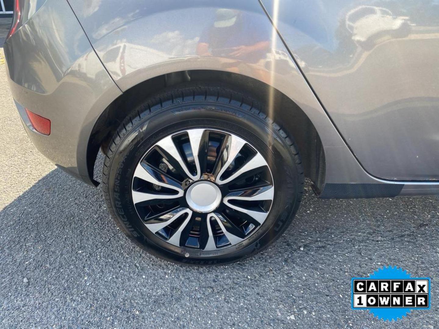 2014 Storm Gray Metallic /Charcoal Black w/Red Stitching Ford Fiesta SE (3FADP4EJ9EM) with an L4, 1.6L engine, 5-speed manual transmission, located at 3147 E Independence Blvd, Charlotte, NC, 28205, 35.200268, -80.773651 - <b>Equipment</b><br>This 2014 Ford Fiesta features a hands-free Bluetooth phone system. This vehicle is a certified CARFAX 1-owner. This vehicle has a L4, 1.6L high output engine. Front wheel drive on this 2014 Ford Fiesta gives you better traction and better fuel economy. Set the temperature exac - Photo#14