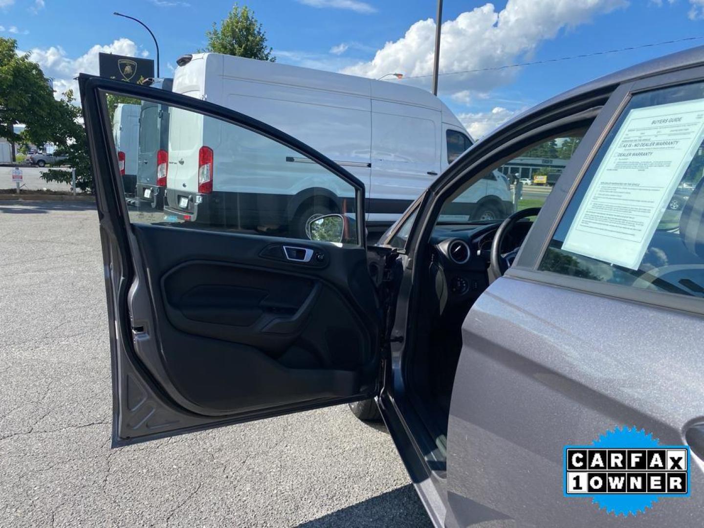 2014 Storm Gray Metallic /Charcoal Black w/Red Stitching Ford Fiesta SE (3FADP4EJ9EM) with an L4, 1.6L engine, 5-speed manual transmission, located at 3147 E Independence Blvd, Charlotte, NC, 28205, 35.200268, -80.773651 - <b>Equipment</b><br>This 2014 Ford Fiesta features a hands-free Bluetooth phone system. This vehicle is a certified CARFAX 1-owner. This vehicle has a L4, 1.6L high output engine. Front wheel drive on this 2014 Ford Fiesta gives you better traction and better fuel economy. Set the temperature exac - Photo#18