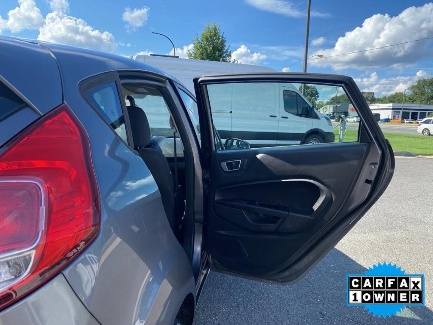 2014 Storm Gray Metallic /Charcoal Black w/Red Stitching Ford Fiesta SE (3FADP4EJ9EM) with an L4, 1.6L engine, 5-speed manual transmission, located at 3147 E Independence Blvd, Charlotte, NC, 28205, 35.200268, -80.773651 - <b>Equipment</b><br>This 2014 Ford Fiesta features a hands-free Bluetooth phone system. This vehicle is a certified CARFAX 1-owner. This vehicle has a L4, 1.6L high output engine. Front wheel drive on this 2014 Ford Fiesta gives you better traction and better fuel economy. Set the temperature exac - Photo#21