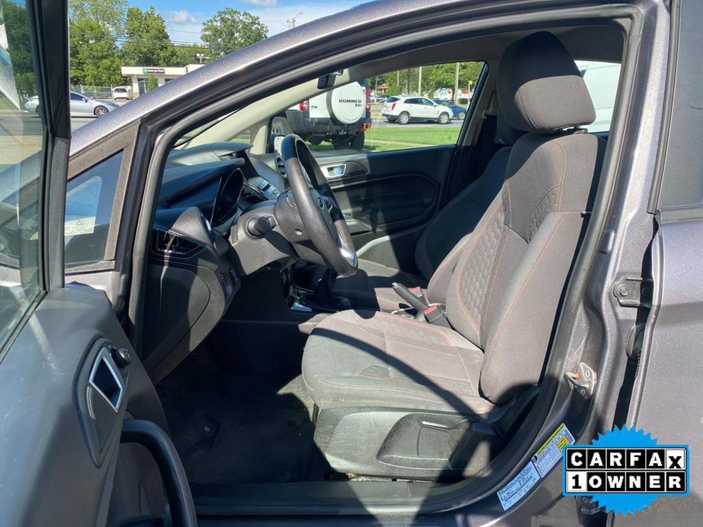 2014 Storm Gray Metallic /Charcoal Black w/Red Stitching Ford Fiesta SE (3FADP4EJ9EM) with an L4, 1.6L engine, 5-speed manual transmission, located at 3147 E Independence Blvd, Charlotte, NC, 28205, 35.200268, -80.773651 - <b>Equipment</b><br>This 2014 Ford Fiesta features a hands-free Bluetooth phone system. This vehicle is a certified CARFAX 1-owner. This vehicle has a L4, 1.6L high output engine. Front wheel drive on this 2014 Ford Fiesta gives you better traction and better fuel economy. Set the temperature exac - Photo#23