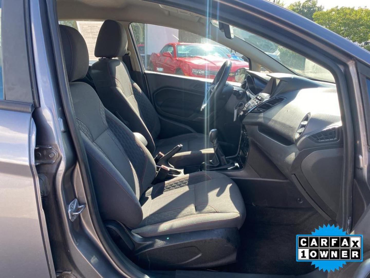 2014 Storm Gray Metallic /Charcoal Black w/Red Stitching Ford Fiesta SE (3FADP4EJ9EM) with an L4, 1.6L engine, 5-speed manual transmission, located at 3147 E Independence Blvd, Charlotte, NC, 28205, 35.200268, -80.773651 - <b>Equipment</b><br>This 2014 Ford Fiesta features a hands-free Bluetooth phone system. This vehicle is a certified CARFAX 1-owner. This vehicle has a L4, 1.6L high output engine. Front wheel drive on this 2014 Ford Fiesta gives you better traction and better fuel economy. Set the temperature exac - Photo#26