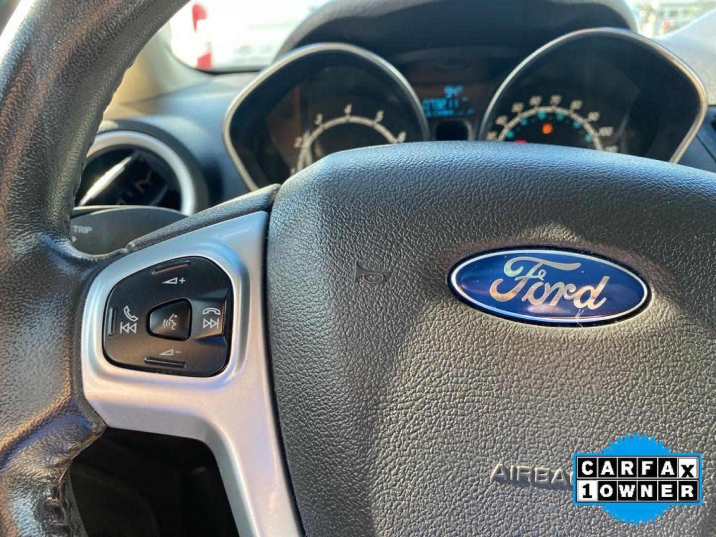 2014 Storm Gray Metallic /Charcoal Black w/Red Stitching Ford Fiesta SE (3FADP4EJ9EM) with an L4, 1.6L engine, 5-speed manual transmission, located at 3147 E Independence Blvd, Charlotte, NC, 28205, 35.200268, -80.773651 - <b>Equipment</b><br>This 2014 Ford Fiesta features a hands-free Bluetooth phone system. This vehicle is a certified CARFAX 1-owner. This vehicle has a L4, 1.6L high output engine. Front wheel drive on this 2014 Ford Fiesta gives you better traction and better fuel economy. Set the temperature exac - Photo#2