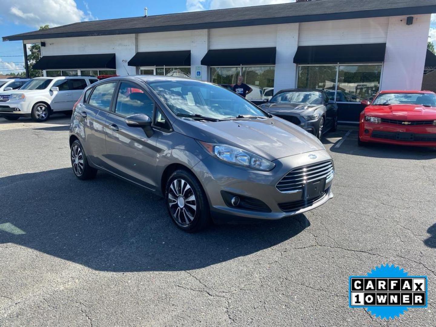 2014 Storm Gray Metallic /Charcoal Black w/Red Stitching Ford Fiesta SE (3FADP4EJ9EM) with an L4, 1.6L engine, 5-speed manual transmission, located at 3147 E Independence Blvd, Charlotte, NC, 28205, 35.200268, -80.773651 - <b>Equipment</b><br>This 2014 Ford Fiesta features a hands-free Bluetooth phone system. This vehicle is a certified CARFAX 1-owner. This vehicle has a L4, 1.6L high output engine. Front wheel drive on this 2014 Ford Fiesta gives you better traction and better fuel economy. Set the temperature exac - Photo#6