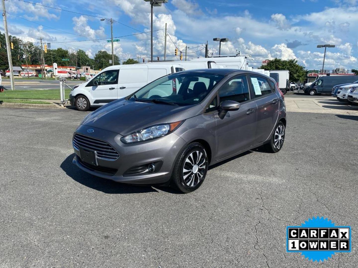 2014 Storm Gray Metallic /Charcoal Black w/Red Stitching Ford Fiesta SE (3FADP4EJ9EM) with an L4, 1.6L engine, 5-speed manual transmission, located at 3147 E Independence Blvd, Charlotte, NC, 28205, 35.200268, -80.773651 - <b>Equipment</b><br>This 2014 Ford Fiesta features a hands-free Bluetooth phone system. This vehicle is a certified CARFAX 1-owner. This vehicle has a L4, 1.6L high output engine. Front wheel drive on this 2014 Ford Fiesta gives you better traction and better fuel economy. Set the temperature exac - Photo#8