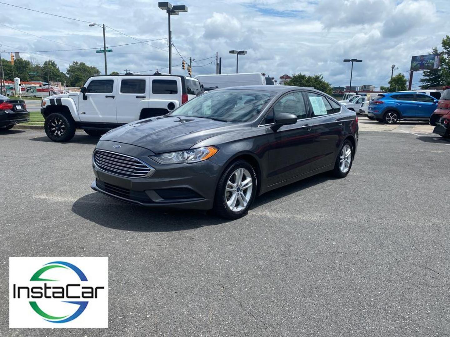 2018 Magnetic Metallic /Ebony Ford Fusion SE (3FA6P0H75JR) with an L4, 2.5L engine, 6-speed automatic transmission, located at 3147 E Independence Blvd, Charlotte, NC, 28205, 35.200268, -80.773651 - <b>Equipment</b><br>It is equipped with the latest generation of XM/Sirius Radio. Protect this 2018 Ford Fusion from unwanted accidents with a cutting edge backup camera system. This Ford Fusion features a hands-free Bluetooth phone system. The Ford Fusion has satellite radio capabilities. Set the - Photo#9