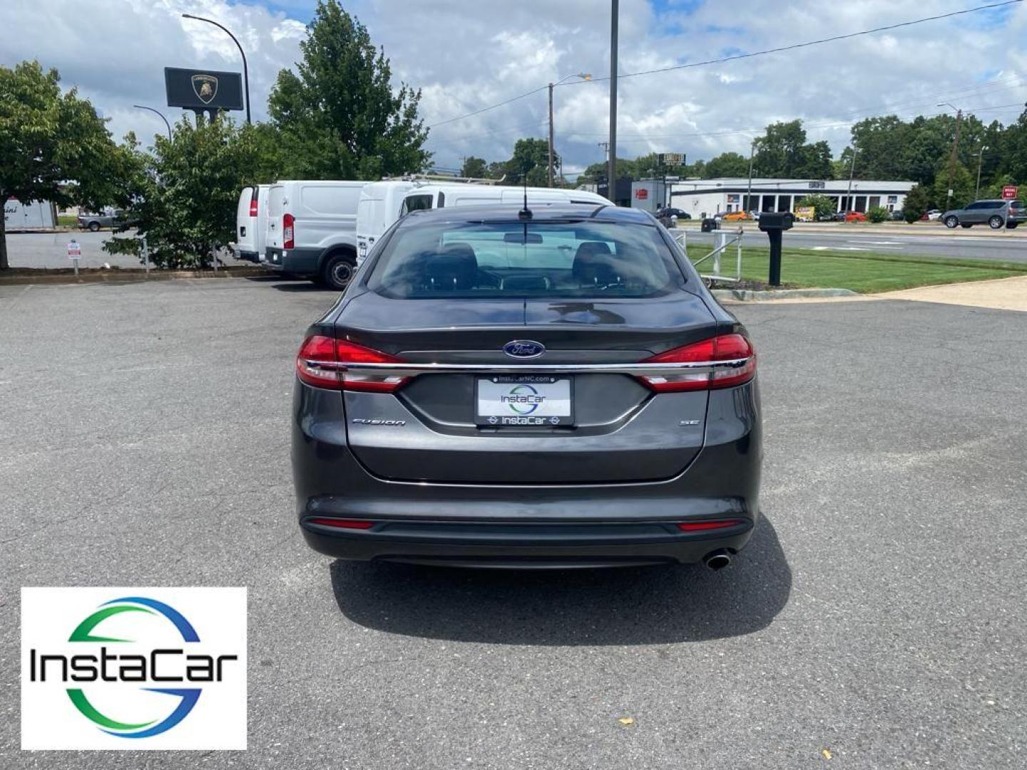 2018 Magnetic Metallic /Ebony Ford Fusion SE (3FA6P0H75JR) with an L4, 2.5L engine, 6-speed automatic transmission, located at 3147 E Independence Blvd, Charlotte, NC, 28205, 35.200268, -80.773651 - <b>Equipment</b><br>It is equipped with the latest generation of XM/Sirius Radio. Protect this 2018 Ford Fusion from unwanted accidents with a cutting edge backup camera system. This Ford Fusion features a hands-free Bluetooth phone system. The Ford Fusion has satellite radio capabilities. Set the - Photo#12