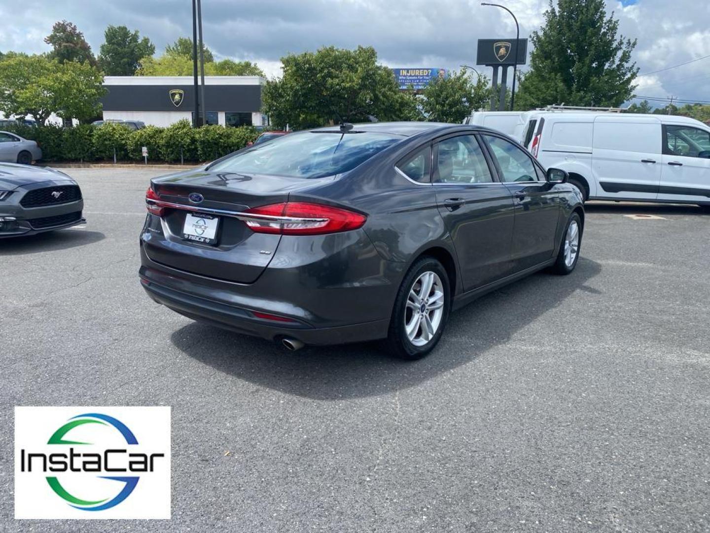 2018 Magnetic Metallic /Ebony Ford Fusion SE (3FA6P0H75JR) with an L4, 2.5L engine, 6-speed automatic transmission, located at 3147 E Independence Blvd, Charlotte, NC, 28205, 35.200268, -80.773651 - <b>Equipment</b><br>It is equipped with the latest generation of XM/Sirius Radio. Protect this 2018 Ford Fusion from unwanted accidents with a cutting edge backup camera system. This Ford Fusion features a hands-free Bluetooth phone system. The Ford Fusion has satellite radio capabilities. Set the - Photo#13