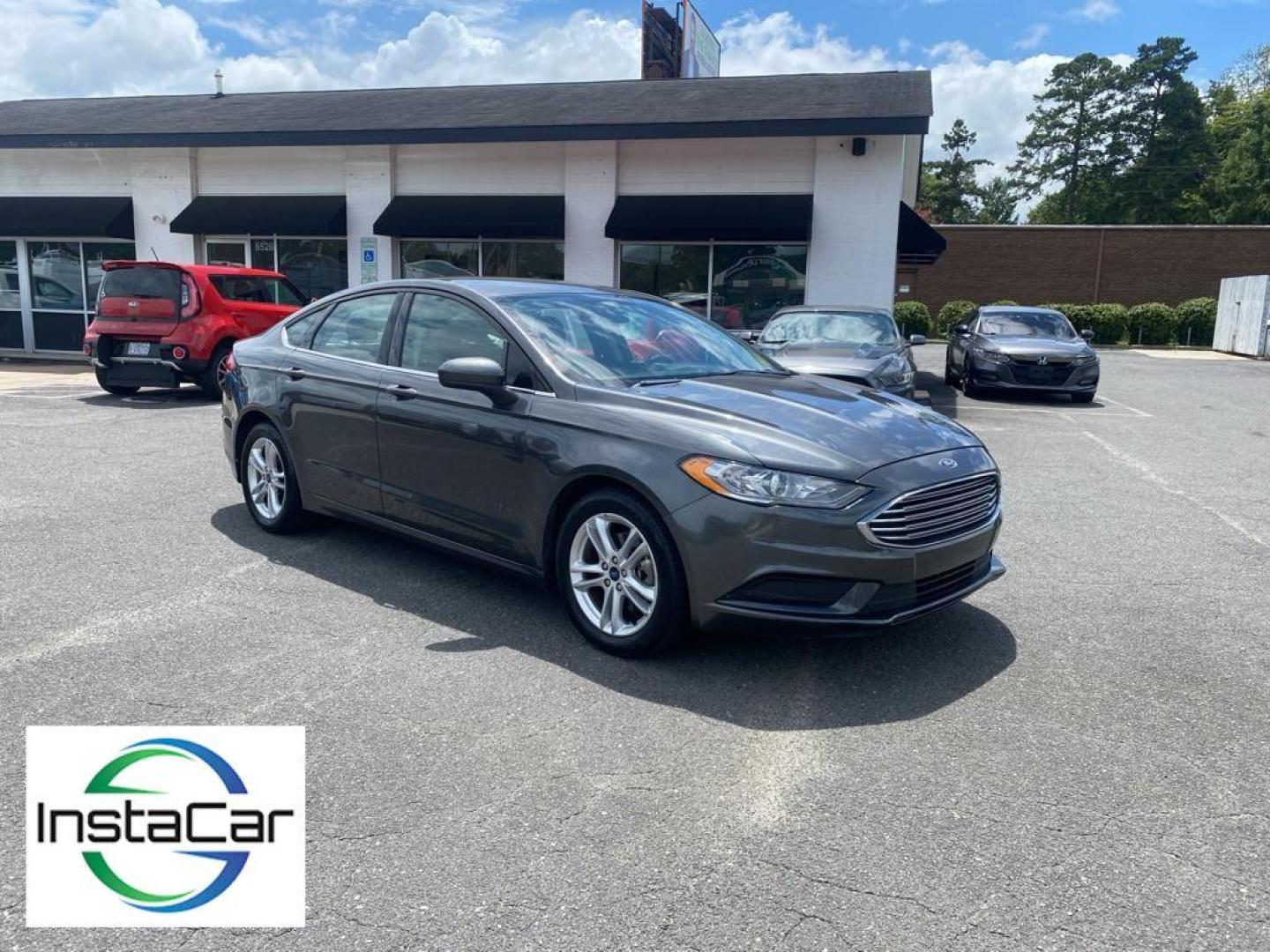 2018 Magnetic Metallic /Ebony Ford Fusion SE (3FA6P0H75JR) with an L4, 2.5L engine, 6-speed automatic transmission, located at 3147 E Independence Blvd, Charlotte, NC, 28205, 35.200268, -80.773651 - <b>Equipment</b><br>It is equipped with the latest generation of XM/Sirius Radio. Protect this 2018 Ford Fusion from unwanted accidents with a cutting edge backup camera system. This Ford Fusion features a hands-free Bluetooth phone system. The Ford Fusion has satellite radio capabilities. Set the - Photo#7