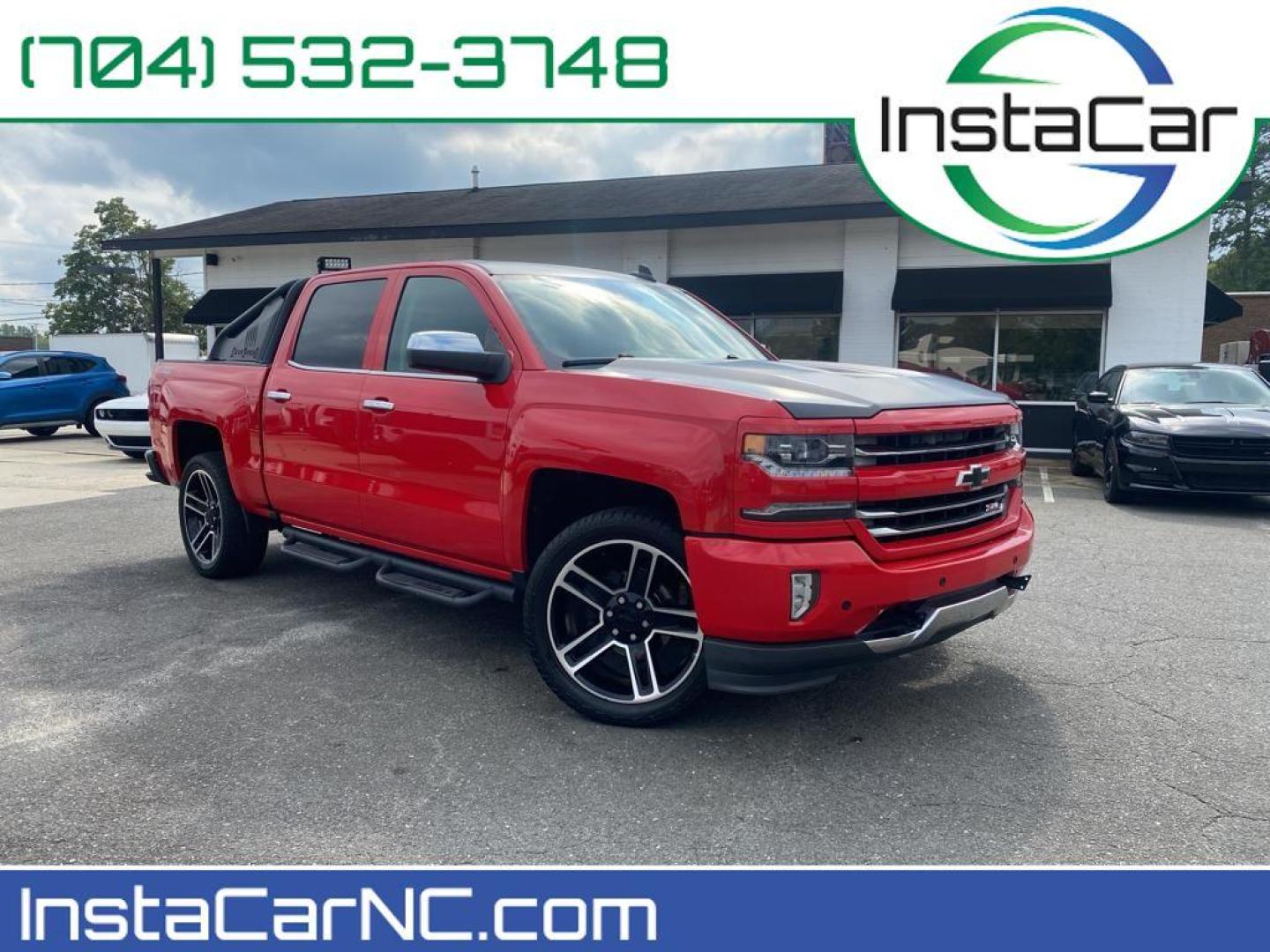 2016 Red Hot /Jet Black Chevrolet Silverado LTZ (3GCUKSECXGG) with an V8, 5.3L engine, 8-speed automatic transmission, located at 3147 E Independence Blvd, Charlotte, NC, 28205, 35.200268, -80.773651 - <b>Equipment</b><br>This vehicle features a hands-free Bluetooth phone system. The rear parking assist technology on this 1/2 ton pickup will put you at ease when reversing. The system alerts you as you get closer to an obstruction. This 1/2 ton pickup stays safely in its lane with Lane Keep Assist - Photo#0