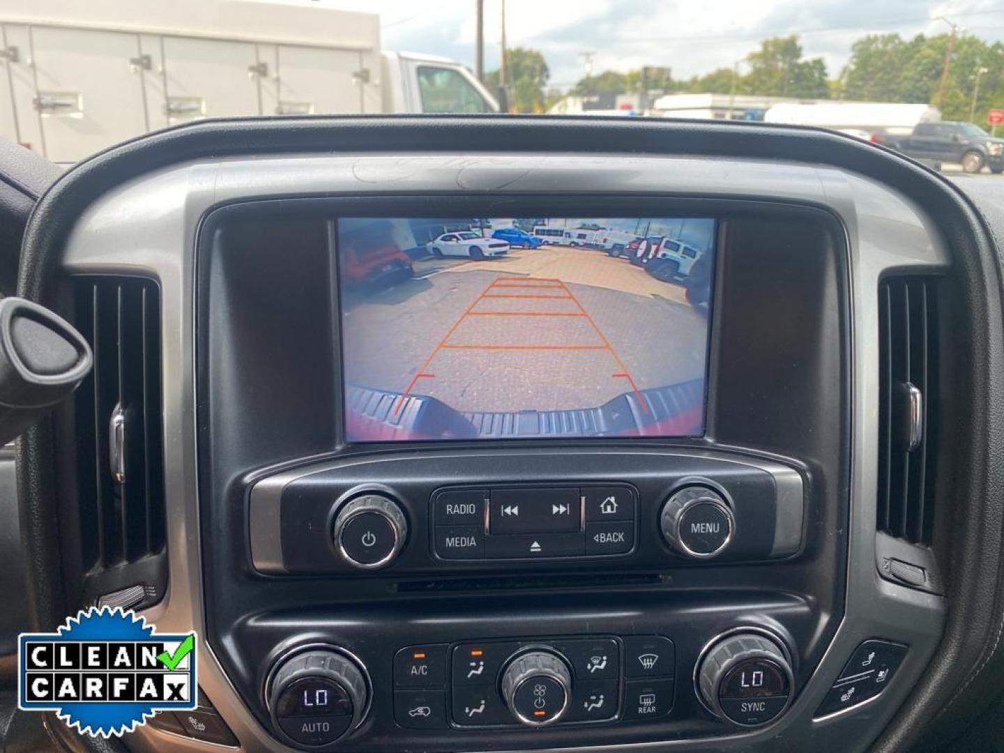 2016 Red Hot /Jet Black Chevrolet Silverado LTZ (3GCUKSECXGG) with an V8, 5.3L engine, 8-speed automatic transmission, located at 3147 E Independence Blvd, Charlotte, NC, 28205, 35.200268, -80.773651 - <b>Equipment</b><br>This vehicle features a hands-free Bluetooth phone system. The rear parking assist technology on this 1/2 ton pickup will put you at ease when reversing. The system alerts you as you get closer to an obstruction. This 1/2 ton pickup stays safely in its lane with Lane Keep Assist - Photo#3