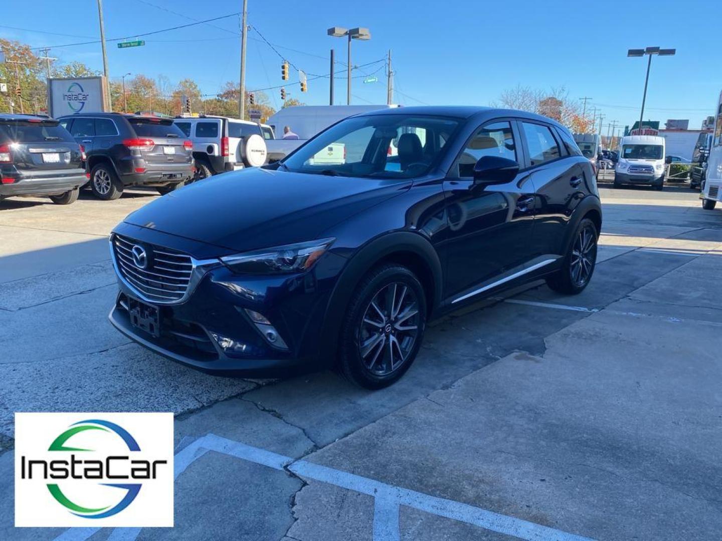 2017 Deep Crystal Blue Mica /Black Mazda CX-3 Grand Touring (JM1DKFD77H0) with an 4 Cyl, 2.0L engine, 6-speed automatic transmission, located at 3147 E Independence Blvd, Charlotte, NC, 28205, 35.200268, -80.773651 - Photo#9