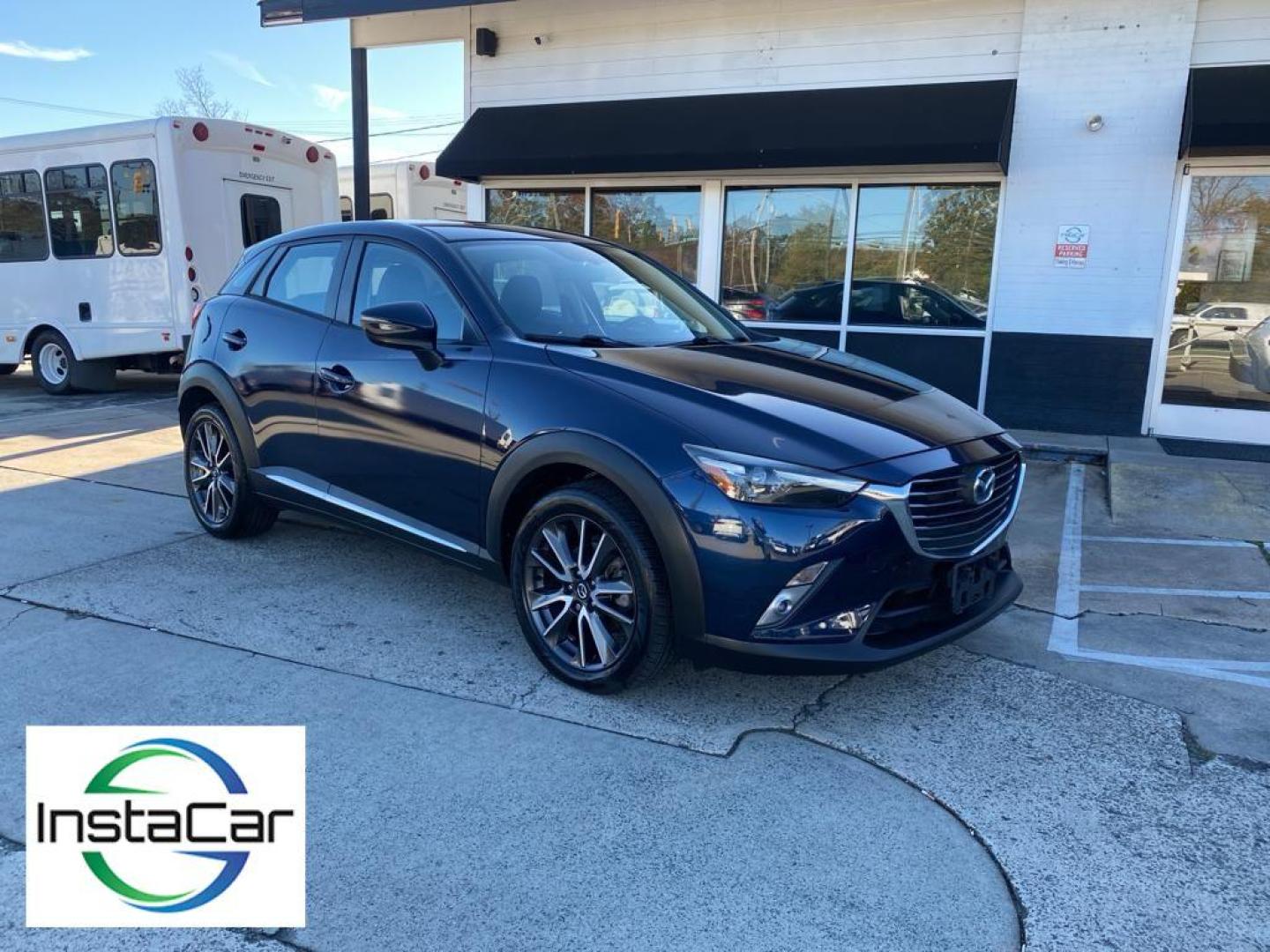 2017 Deep Crystal Blue Mica /Black Mazda CX-3 Grand Touring (JM1DKFD77H0) with an 4 Cyl, 2.0L engine, 6-speed automatic transmission, located at 3147 E Independence Blvd, Charlotte, NC, 28205, 35.200268, -80.773651 - Photo#7