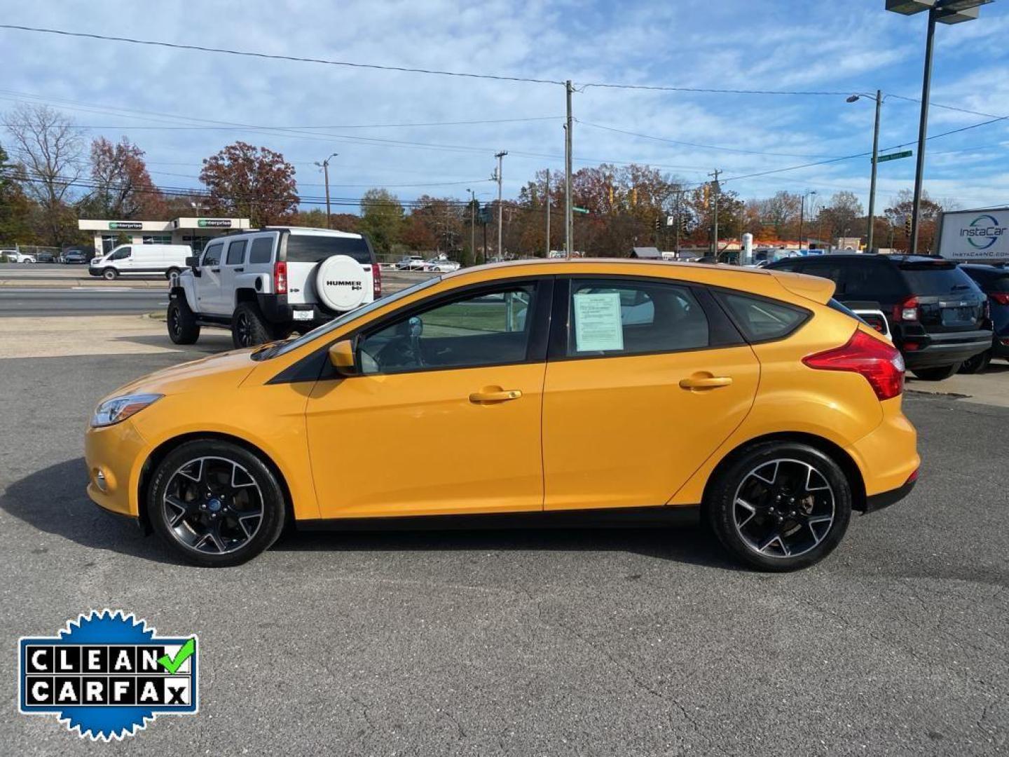 2012 Yellow Blaze Metallic Tri-coat /Charcoal Black w/Metal Gray Surround Ford Focus SE (1FAHP3K27CL) with an 4 Cyl, 2.0L engine, 6-speed auto-shift manual transmission, located at 3147 E Independence Blvd, Charlotte, NC, 28205, 35.200268, -80.773651 - For sale at our dealership is a well-maintained 2012 Ford Focus SE, perfect for those seeking a reliable and efficient vehicle. This compact sedan is equipped with a fuel-efficient 4-cylinder, 2.0L engine, providing a smooth and responsive driving experience. With front-wheel drive, the Focus SE off - Photo#9