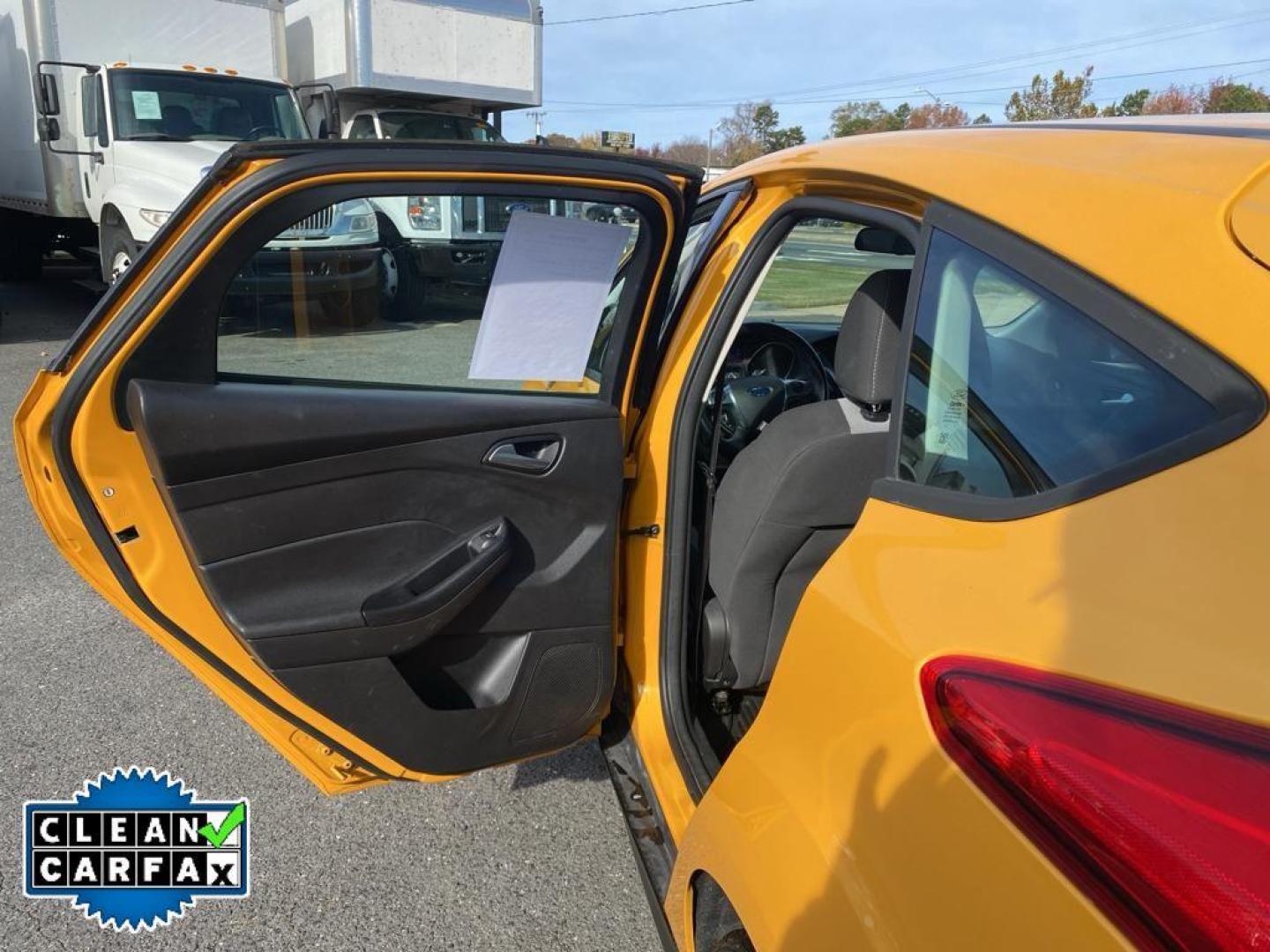 2012 Yellow Blaze Metallic Tri-coat /Charcoal Black w/Metal Gray Surround Ford Focus SE (1FAHP3K27CL) with an 4 Cyl, 2.0L engine, 6-speed auto-shift manual transmission, located at 3147 E Independence Blvd, Charlotte, NC, 28205, 35.200268, -80.773651 - For sale at our dealership is a well-maintained 2012 Ford Focus SE, perfect for those seeking a reliable and efficient vehicle. This compact sedan is equipped with a fuel-efficient 4-cylinder, 2.0L engine, providing a smooth and responsive driving experience. With front-wheel drive, the Focus SE off - Photo#20