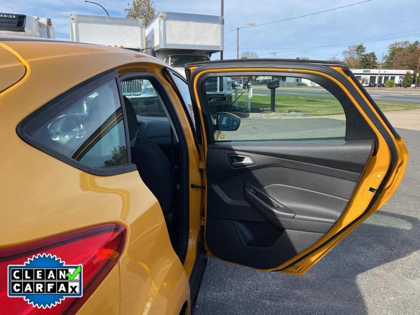 2012 Yellow Blaze Metallic Tri-coat /Charcoal Black w/Metal Gray Surround Ford Focus SE (1FAHP3K27CL) with an 4 Cyl, 2.0L engine, 6-speed auto-shift manual transmission, located at 3147 E Independence Blvd, Charlotte, NC, 28205, 35.200268, -80.773651 - For sale at our dealership is a well-maintained 2012 Ford Focus SE, perfect for those seeking a reliable and efficient vehicle. This compact sedan is equipped with a fuel-efficient 4-cylinder, 2.0L engine, providing a smooth and responsive driving experience. With front-wheel drive, the Focus SE off - Photo#21