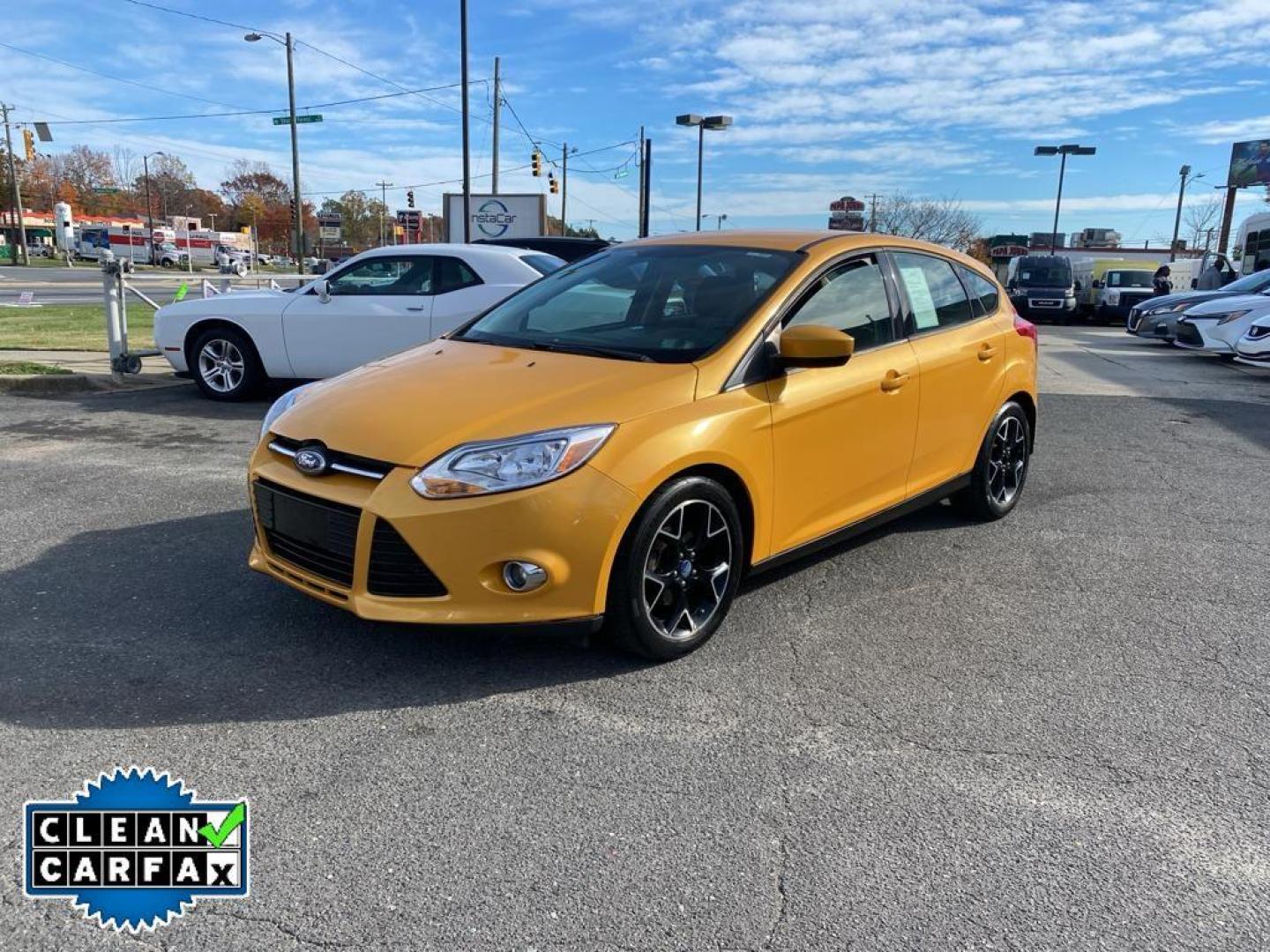 2012 Yellow Blaze Metallic Tri-coat /Charcoal Black w/Metal Gray Surround Ford Focus SE (1FAHP3K27CL) with an 4 Cyl, 2.0L engine, 6-speed auto-shift manual transmission, located at 3147 E Independence Blvd, Charlotte, NC, 28205, 35.200268, -80.773651 - For sale at our dealership is a well-maintained 2012 Ford Focus SE, perfect for those seeking a reliable and efficient vehicle. This compact sedan is equipped with a fuel-efficient 4-cylinder, 2.0L engine, providing a smooth and responsive driving experience. With front-wheel drive, the Focus SE off - Photo#8