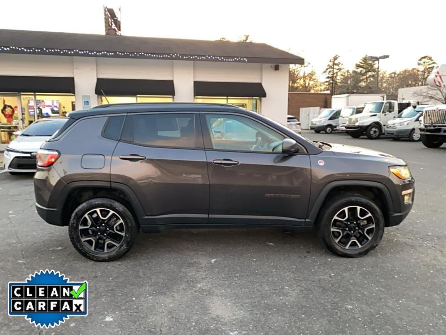 2021 Granite Crystal Metallic Clearcoat /Ruby Red/Black Jeep Compass Trailhawk (3C4NJDDB6MT) with an 4 Cyl, 2.4L engine, 9-speed automatic transmission, located at 3147 E Independence Blvd, Charlotte, NC, 28205, 35.200268, -80.773651 - <b>Equipment</b><br>The leather seats in it are a must for buyers looking for comfort, durability, and style. It's Forward Collision Warning feature alerts drivers to potential front-end collisions. The vehicle's Lane Departure Warning keeps you safe by alerting you when you drift from your lane. Th - Photo#14