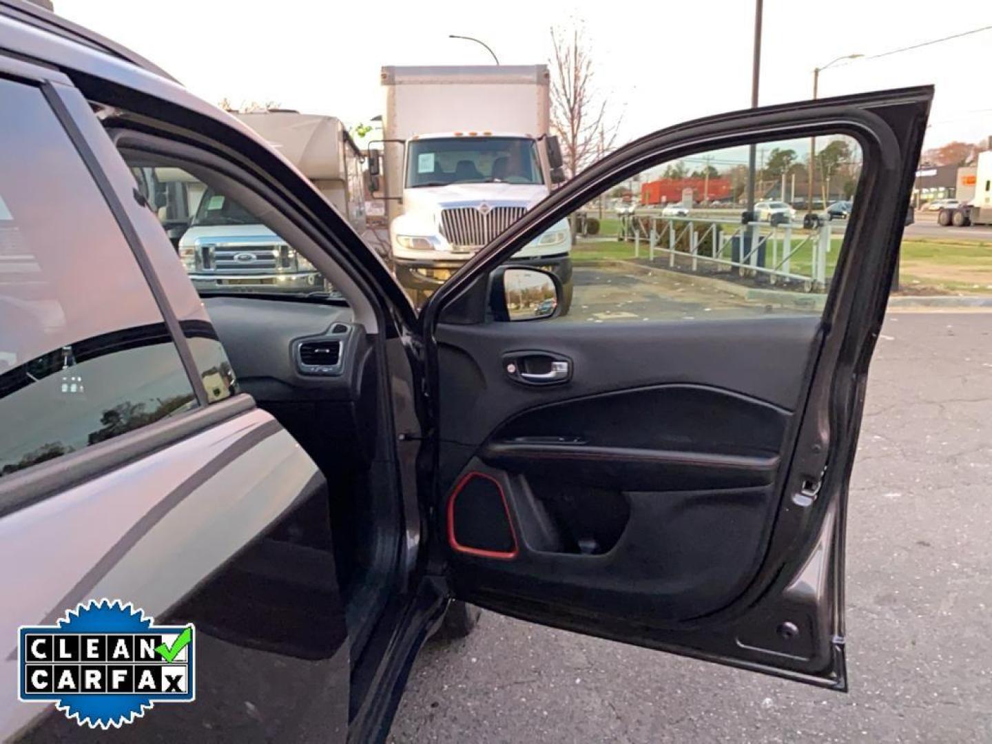 2021 Granite Crystal Metallic Clearcoat /Ruby Red/Black Jeep Compass Trailhawk (3C4NJDDB6MT) with an 4 Cyl, 2.4L engine, 9-speed automatic transmission, located at 3147 E Independence Blvd, Charlotte, NC, 28205, 35.200268, -80.773651 - <b>Equipment</b><br>The leather seats in it are a must for buyers looking for comfort, durability, and style. It's Forward Collision Warning feature alerts drivers to potential front-end collisions. The vehicle's Lane Departure Warning keeps you safe by alerting you when you drift from your lane. Th - Photo#23