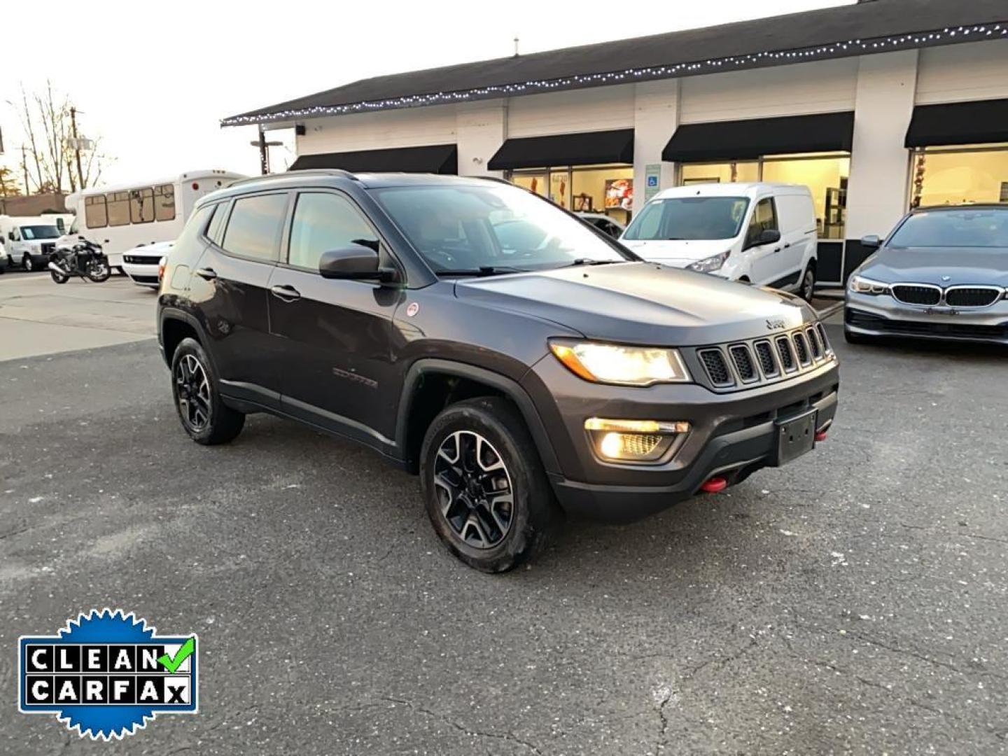 2021 Granite Crystal Metallic Clearcoat /Ruby Red/Black Jeep Compass Trailhawk (3C4NJDDB6MT) with an 4 Cyl, 2.4L engine, 9-speed automatic transmission, located at 3147 E Independence Blvd, Charlotte, NC, 28205, 35.200268, -80.773651 - <b>Equipment</b><br>The leather seats in it are a must for buyers looking for comfort, durability, and style. It's Forward Collision Warning feature alerts drivers to potential front-end collisions. The vehicle's Lane Departure Warning keeps you safe by alerting you when you drift from your lane. Th - Photo#7