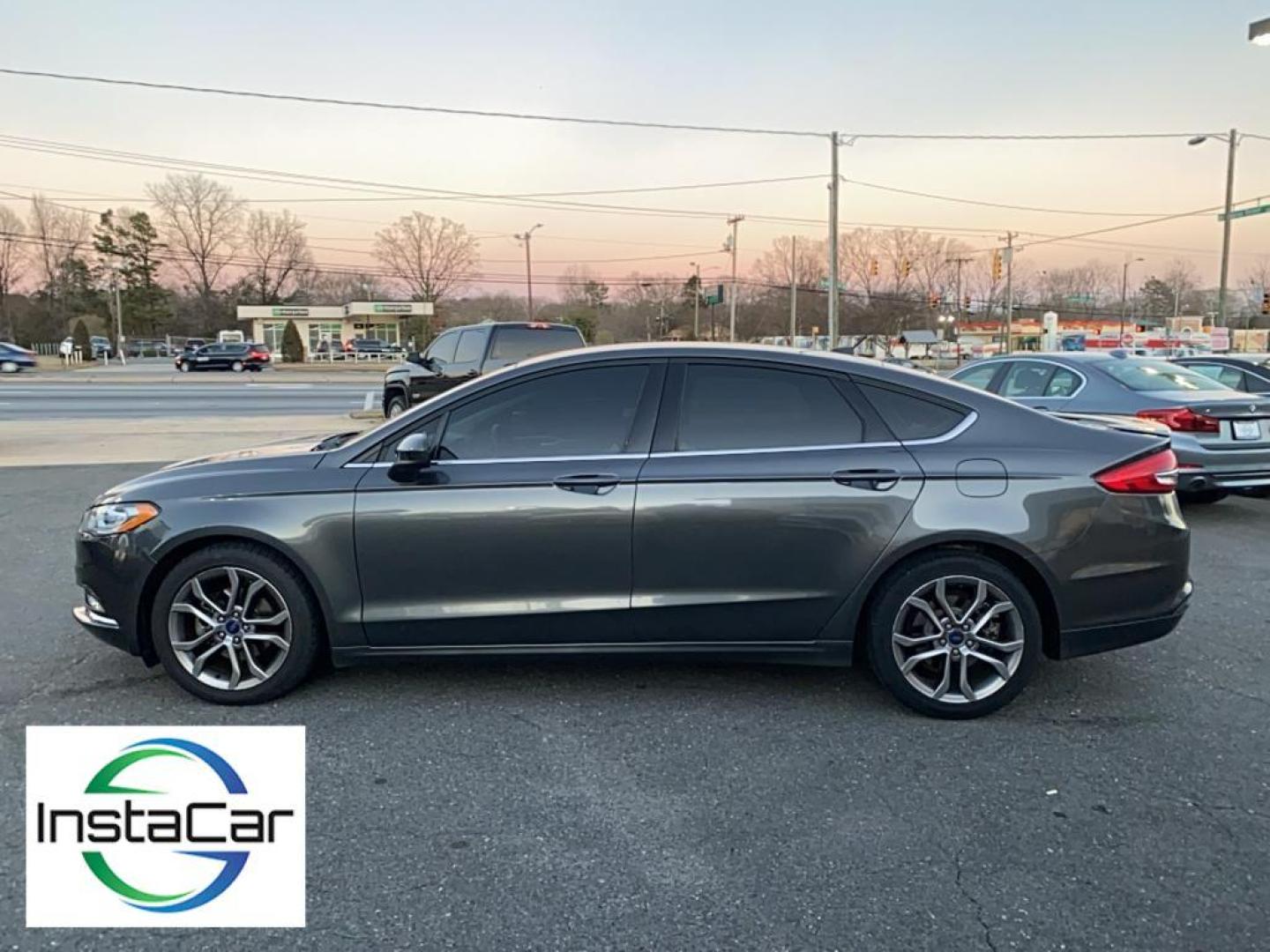 2017 Gray Ford Fusion S (3FA6P0G78HR) with an 4 Cyl, 2.5L engine, Automatic transmission, located at 3147 E Independence Blvd, Charlotte, NC, 28205, 35.200268, -80.773651 - <b>Equipment</b><br>Bluetooth technology is built into this Ford Fusion, keeping your hands on the steering wheel and your focus on the road. Protect this model from unwanted accidents with a cutting edge backup camera system. Quickly unlock this Ford Fusion with keyless entry. This mid-size car is - Photo#9