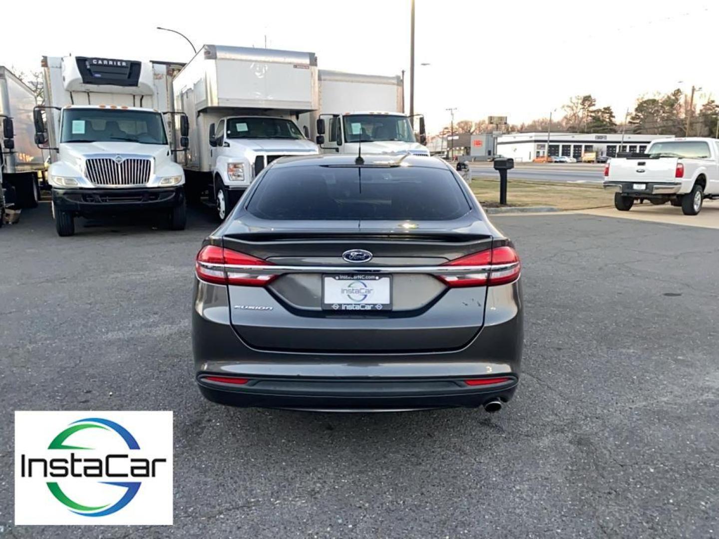 2017 Gray Ford Fusion S (3FA6P0G78HR) with an 4 Cyl, 2.5L engine, Automatic transmission, located at 3147 E Independence Blvd, Charlotte, NC, 28205, 35.200268, -80.773651 - <b>Equipment</b><br>Bluetooth technology is built into this Ford Fusion, keeping your hands on the steering wheel and your focus on the road. Protect this model from unwanted accidents with a cutting edge backup camera system. Quickly unlock this Ford Fusion with keyless entry. This mid-size car is - Photo#11