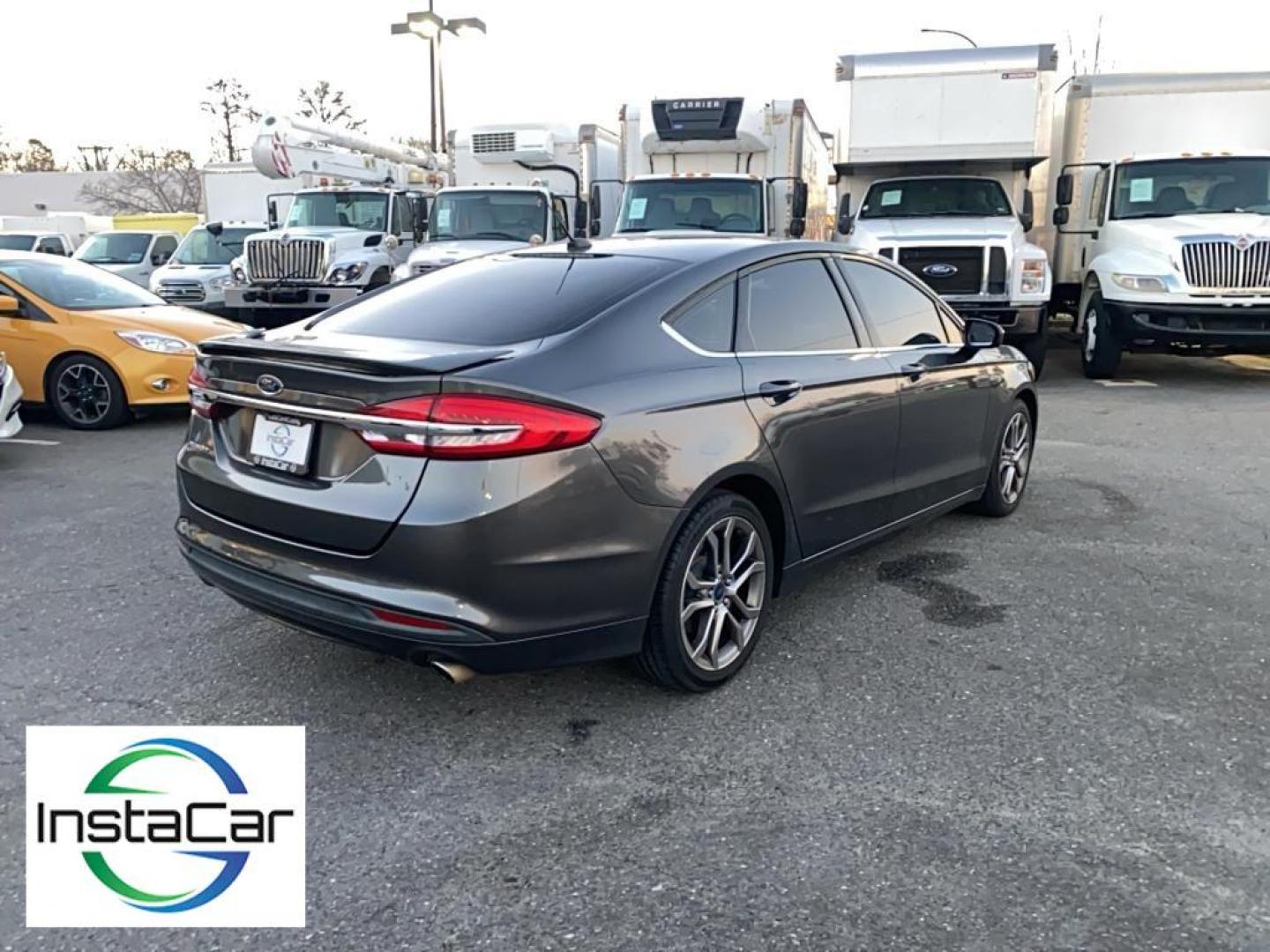 2017 Gray Ford Fusion S (3FA6P0G78HR) with an 4 Cyl, 2.5L engine, Automatic transmission, located at 3147 E Independence Blvd, Charlotte, NC, 28205, 35.200268, -80.773651 - <b>Equipment</b><br>Bluetooth technology is built into this Ford Fusion, keeping your hands on the steering wheel and your focus on the road. Protect this model from unwanted accidents with a cutting edge backup camera system. Quickly unlock this Ford Fusion with keyless entry. This mid-size car is - Photo#12