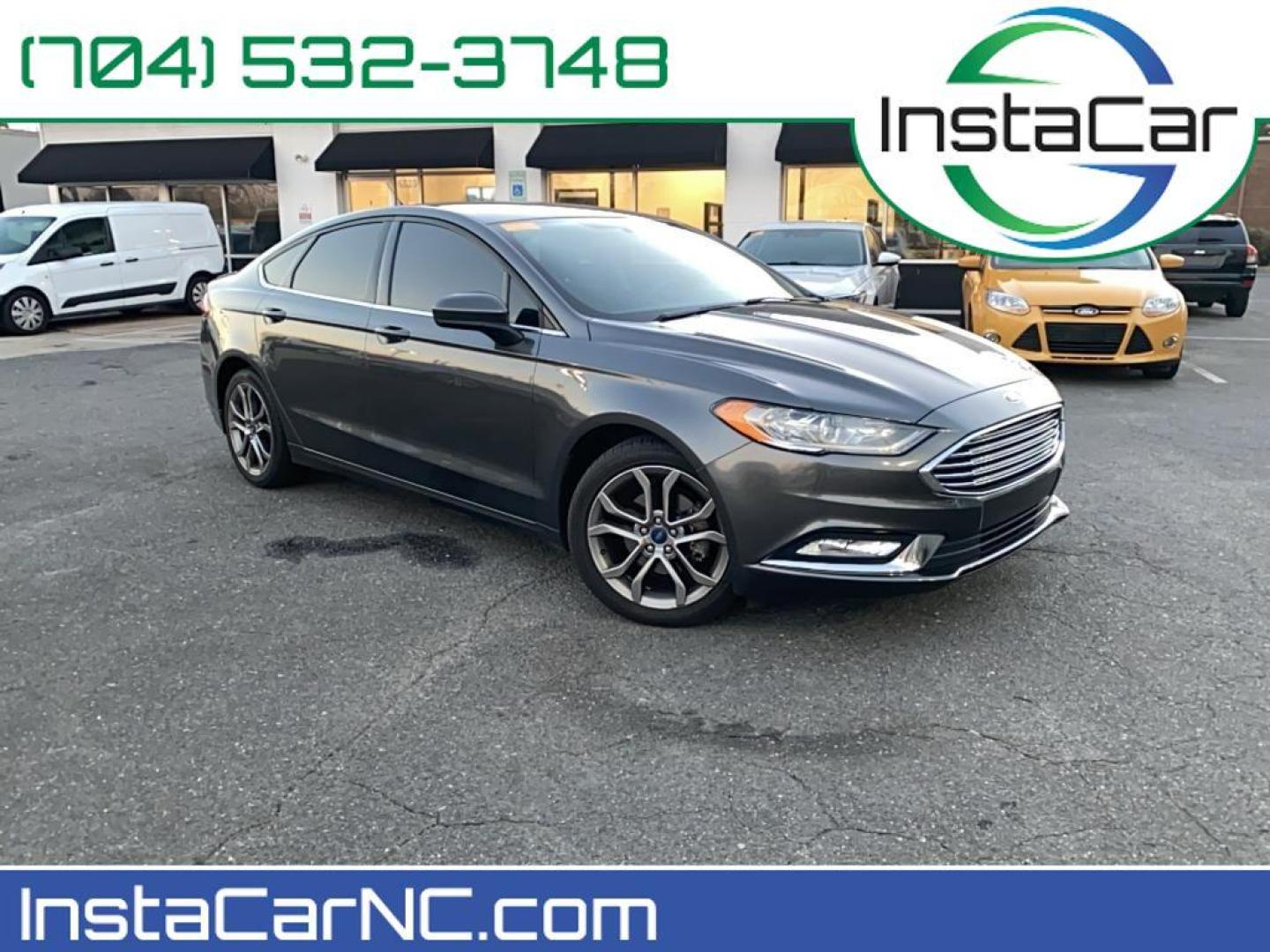 2017 Gray Ford Fusion S (3FA6P0G78HR) with an 4 Cyl, 2.5L engine, Automatic transmission, located at 3147 E Independence Blvd, Charlotte, NC, 28205, 35.200268, -80.773651 - <b>Equipment</b><br>Bluetooth technology is built into this Ford Fusion, keeping your hands on the steering wheel and your focus on the road. Protect this model from unwanted accidents with a cutting edge backup camera system. Quickly unlock this Ford Fusion with keyless entry. This mid-size car is - Photo#0