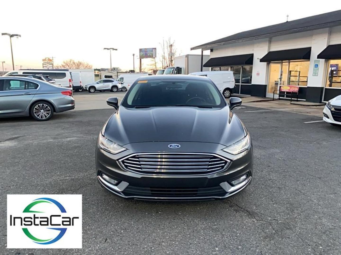 2017 Gray Ford Fusion S (3FA6P0G78HR) with an 4 Cyl, 2.5L engine, Automatic transmission, located at 3147 E Independence Blvd, Charlotte, NC, 28205, 35.200268, -80.773651 - <b>Equipment</b><br>Bluetooth technology is built into this Ford Fusion, keeping your hands on the steering wheel and your focus on the road. Protect this model from unwanted accidents with a cutting edge backup camera system. Quickly unlock this Ford Fusion with keyless entry. This mid-size car is - Photo#7