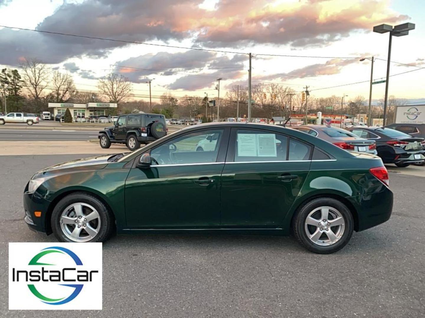 2014 Rainforest Green Metallic /Jet Black Chevrolet Cruze 1LT (1G1PC5SB1E7) with an 4 Cyl, 1.4L engine, 6-speed automatic transmission, located at 3147 E Independence Blvd, Charlotte, NC, 28205, 35.200268, -80.773651 - Rev up your excitement with the 2014 Chevrolet Cruze 1LT, a perfect blend of style, efficiency, and modern technology! This dynamic sedan, featuring a powerful yet fuel-efficient 1.4L 4-cylinder engine, is your ticket to a smooth and exhilarating driving experience. With Front-Wheel Drive, this Cruz - Photo#9