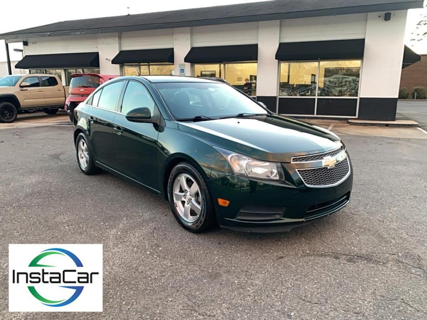 2014 Rainforest Green Metallic /Jet Black Chevrolet Cruze 1LT (1G1PC5SB1E7) with an 4 Cyl, 1.4L engine, 6-speed automatic transmission, located at 3147 E Independence Blvd, Charlotte, NC, 28205, 35.200268, -80.773651 - Rev up your excitement with the 2014 Chevrolet Cruze 1LT, a perfect blend of style, efficiency, and modern technology! This dynamic sedan, featuring a powerful yet fuel-efficient 1.4L 4-cylinder engine, is your ticket to a smooth and exhilarating driving experience. With Front-Wheel Drive, this Cruz - Photo#6