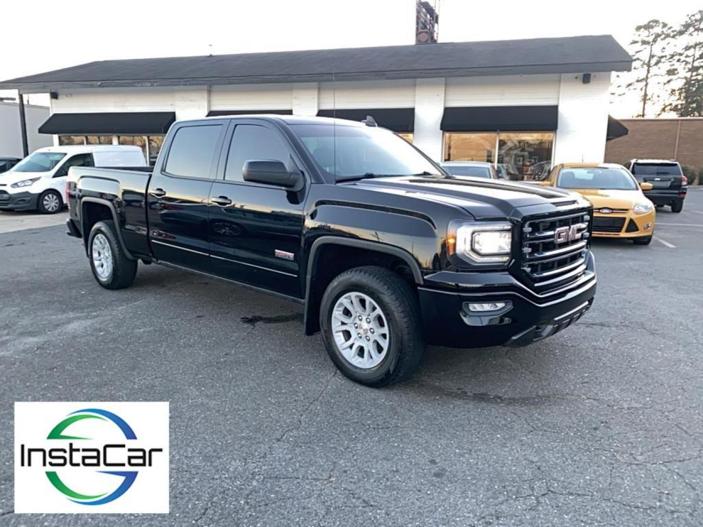 2017 Onyx Black /Jet Black/Spice Red GMC Sierra SLT (3GTU2NEC6HG) with an V8, 5.3L engine, 8-speed automatic transmission, located at 3147 E Independence Blvd, Charlotte, NC, 28205, 35.200268, -80.773651 - Photo#6