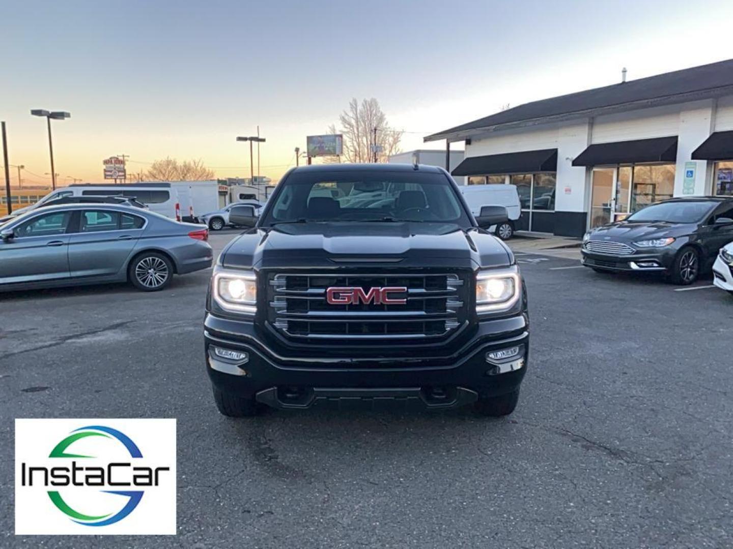 2017 Onyx Black /Jet Black/Spice Red GMC Sierra SLT (3GTU2NEC6HG) with an V8, 5.3L engine, 8-speed automatic transmission, located at 3147 E Independence Blvd, Charlotte, NC, 28205, 35.200268, -80.773651 - <b>Equipment</b><br>Bluetooth technology is built into this GMC Sierra, keeping your hands on the steering wheel and your focus on the road. This model features steering wheel audio controls. An off-road package is equipped on this GMC Sierra. This GMC Sierra keeps you comfortable with Auto Climate. - Photo#7