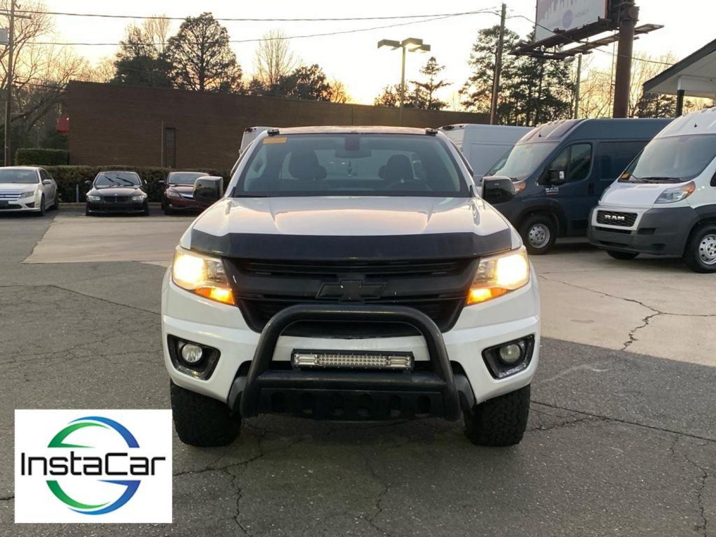 2015 Summit White /Jet Black/Dark Ash Chevrolet Colorado 2WD WT (1GCHSAEA1F1) with an 4 Cyl, 2.5L engine, 6-speed automatic transmission, located at 3147 E Independence Blvd, Charlotte, NC, 28205, 35.200268, -80.773651 - <b>Equipment</b><br>See what's behind you with the back up camera on it. Maintaining a stable interior temperature in this Chevrolet Colorado is easy with the climate control system. This vehicle is rear wheel drive. This unit shines with clean polished lines coated with an elegant white finish. Thi - Photo#5