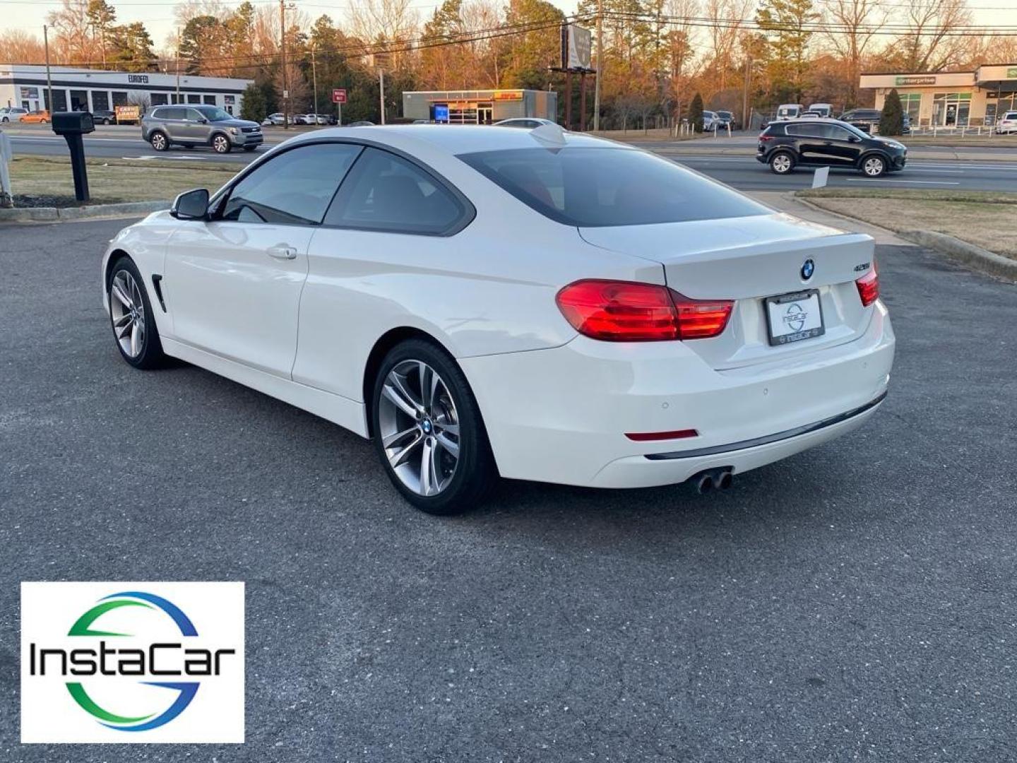 2016 Alpine White /Coral Red w/Black Highlight BMW 4 series 428i (WBA3N7C57GK) with an 4 Cyl, 2.0L engine, 8-speed automatic transmission, located at 3147 E Independence Blvd, Charlotte, NC, 28205, 35.200268, -80.773651 - Discover the perfect blend of performance and luxury with this 2016 BMW 4 Series 428i, a testament to BMW's engineering excellence and sophisticated design. This stylish coupe, equipped with rear-wheel drive, boasts a dynamic 2.0L 4-cylinder engine that delivers an engaging driving experience with i - Photo#11