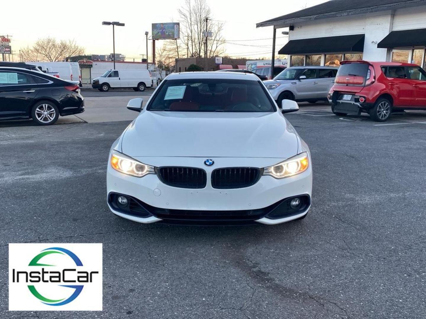 2016 Alpine White /Coral Red w/Black Highlight BMW 4 series 428i (WBA3N7C57GK) with an 4 Cyl, 2.0L engine, 8-speed automatic transmission, located at 3147 E Independence Blvd, Charlotte, NC, 28205, 35.200268, -80.773651 - Discover the perfect blend of performance and luxury with this 2016 BMW 4 Series 428i, a testament to BMW's engineering excellence and sophisticated design. This stylish coupe, equipped with rear-wheel drive, boasts a dynamic 2.0L 4-cylinder engine that delivers an engaging driving experience with i - Photo#8