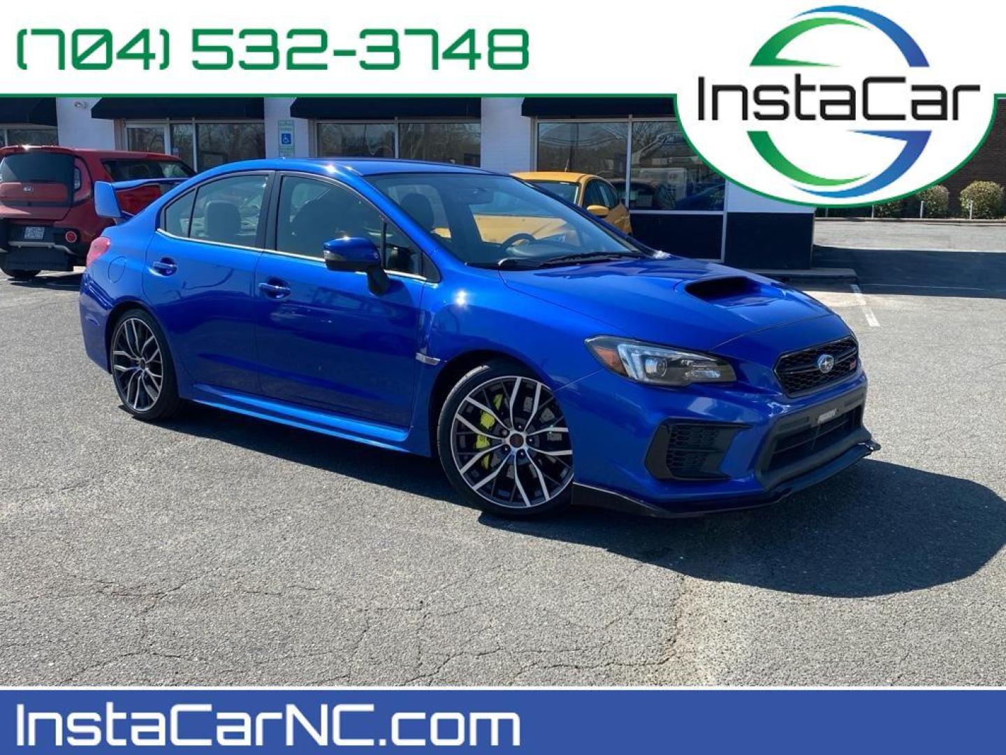 2020 WR Blue Pearl /Black Subaru WRX STI STI (JF1VA2E6XL9) with an 4 Cyl, 2.5L engine, 6-speed manual transmission, located at 3147 E Independence Blvd, Charlotte, NC, 28205, 35.200268, -80.773651 - Discover the exhilaration of driving with this exceptional 2020 Subaru WRX STI, a performance-oriented sedan that seamlessly combines power and precision. Equipped with a robust 4-cylinder, 2.5-liter turbocharged engine, this all-wheel-drive vehicle delivers dynamic handling and impressive accelerat - Photo#0